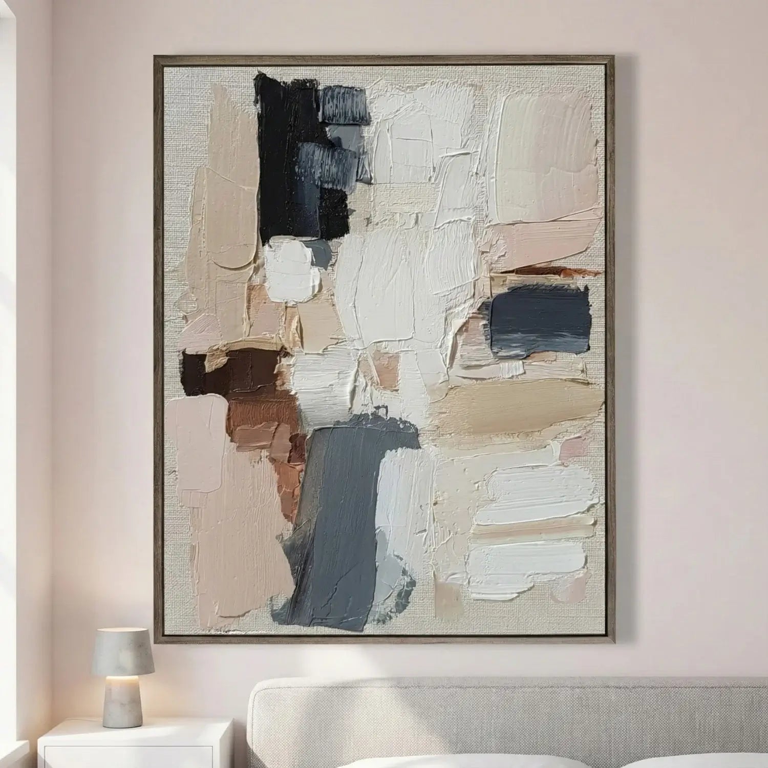 Abstract art piece on a wall in a living room setting