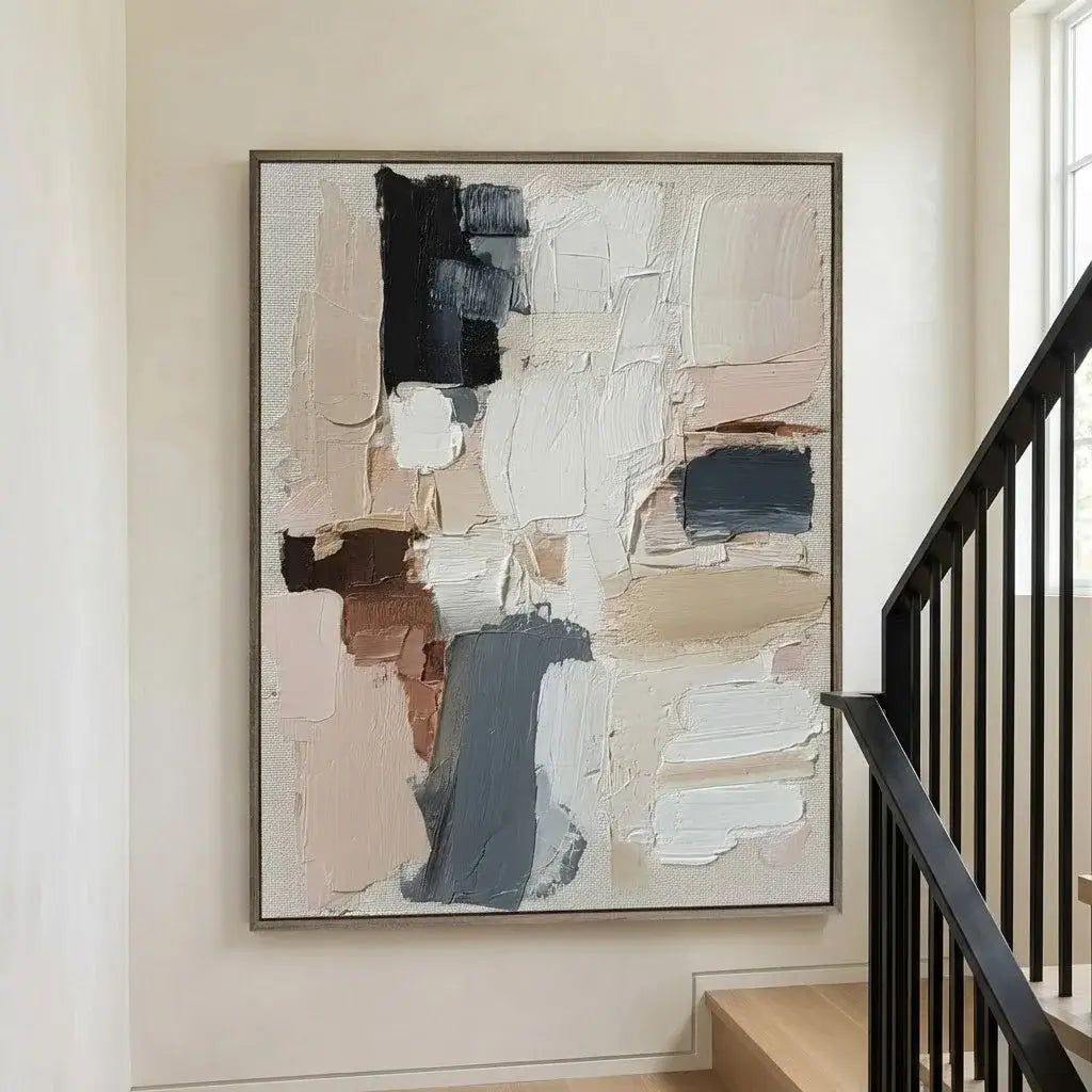 Abstract art piece on a wall in a home setting