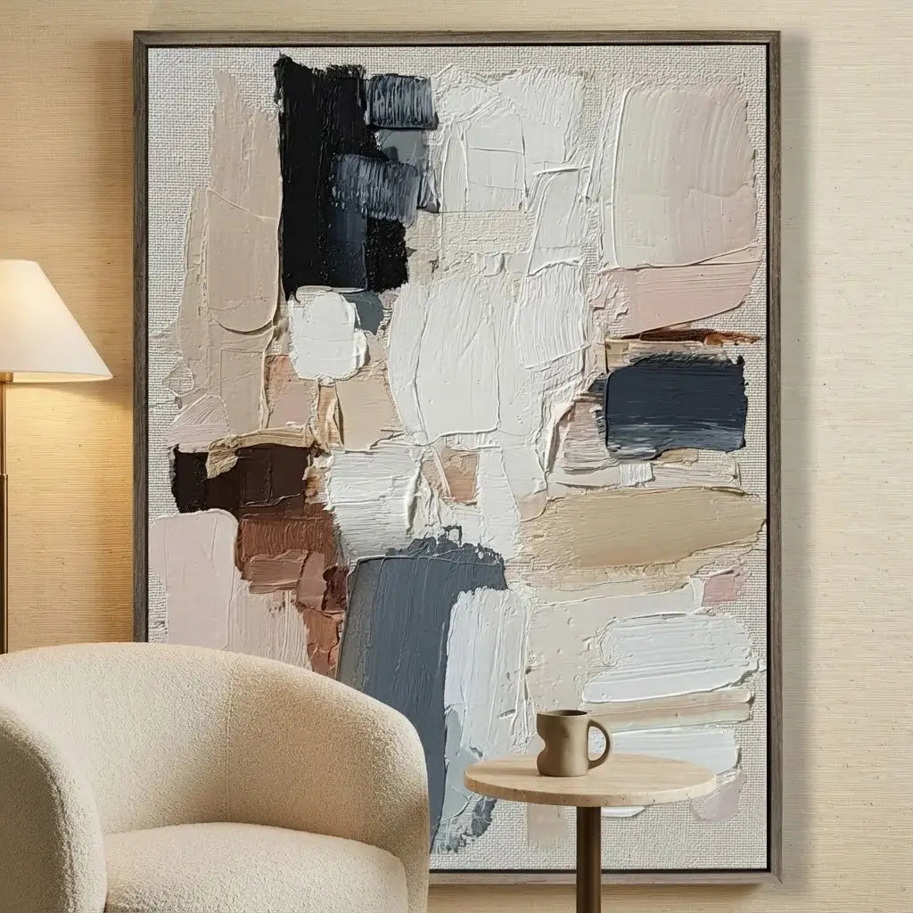 Abstract painting in a modern living room with a chair and table.