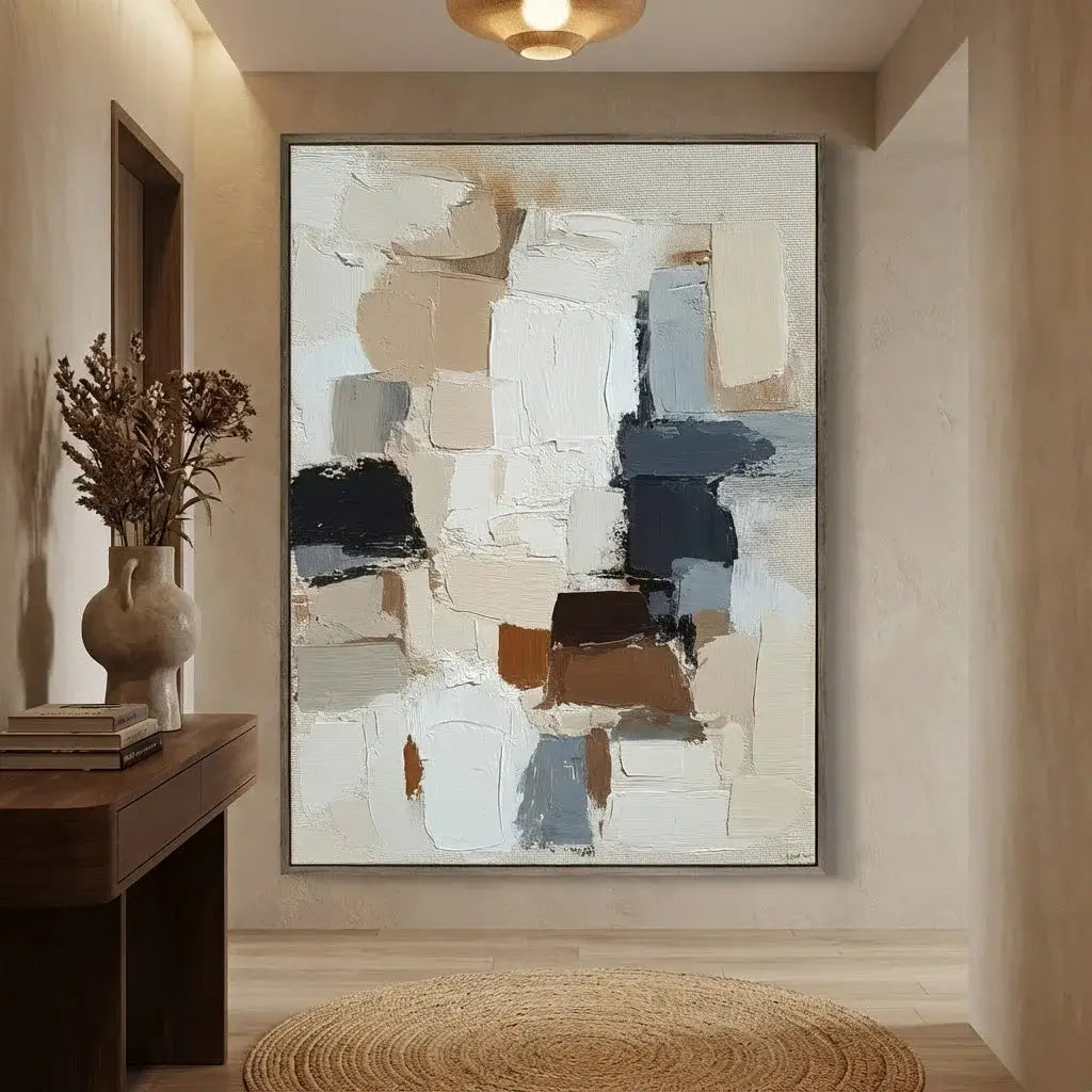 Abstract painting in a modern interior setting with a wooden console table and decorative items.