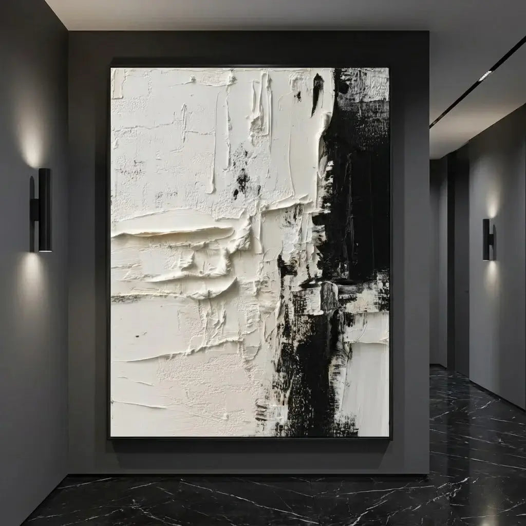 Abstract art piece in a modern interior setting with black and white tones.