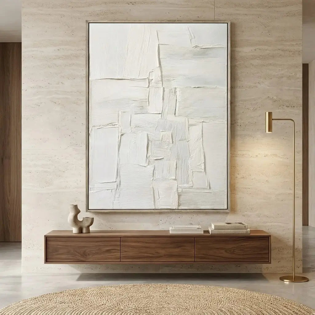 Abstract painting on a wall above a wooden console table in a modern interior setting.