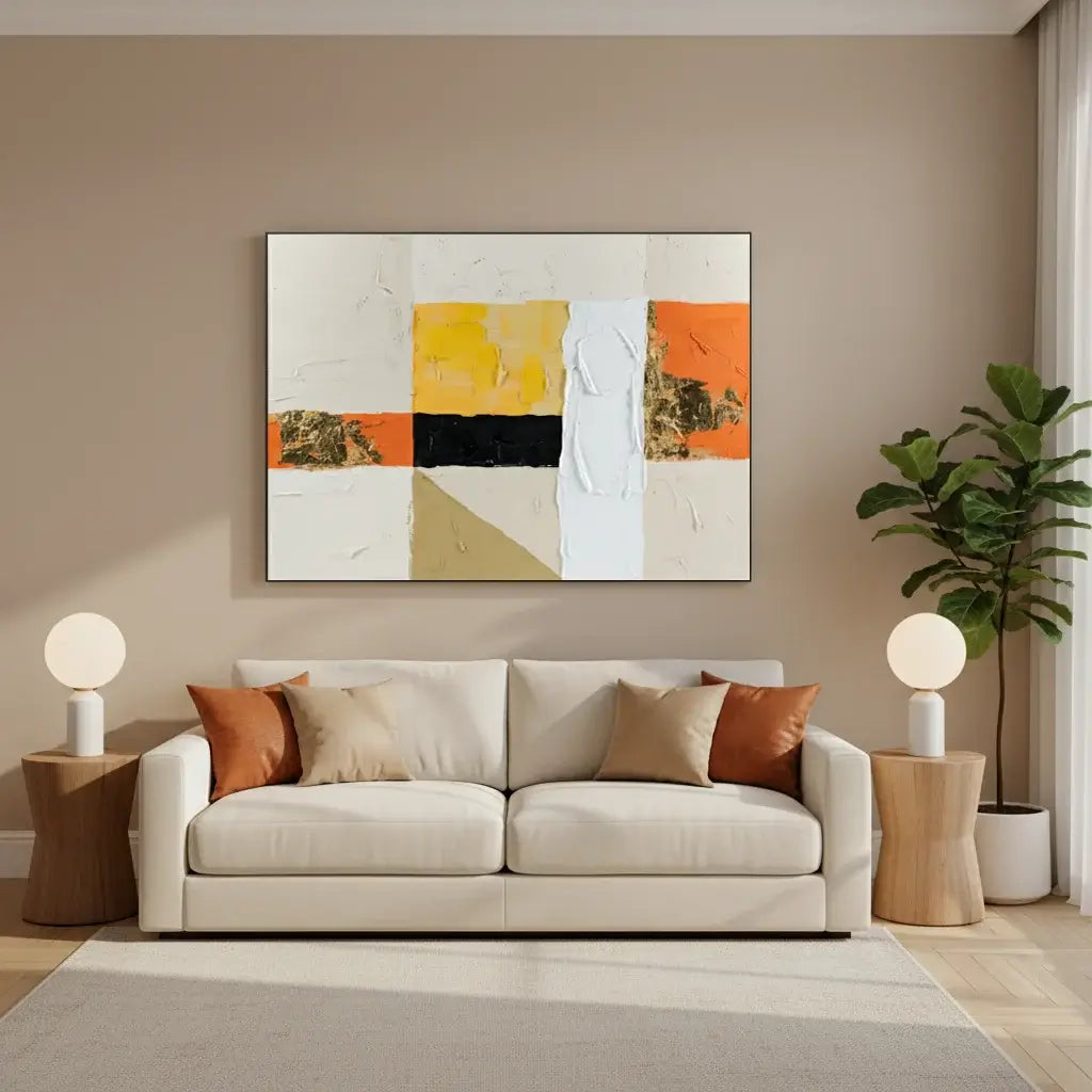 Modern living room with a beige sofa, abstract painting, and decorative items.