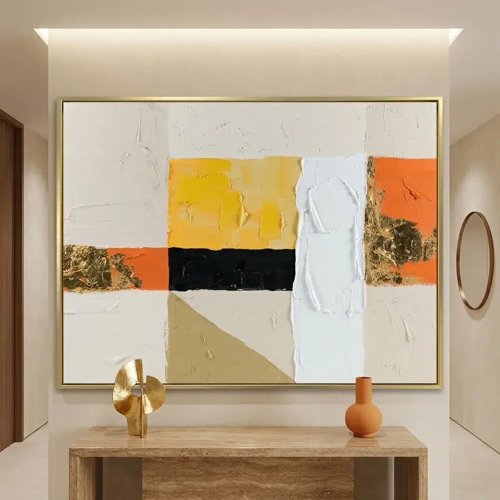 Abstract art painting on a wall above a beige sofa