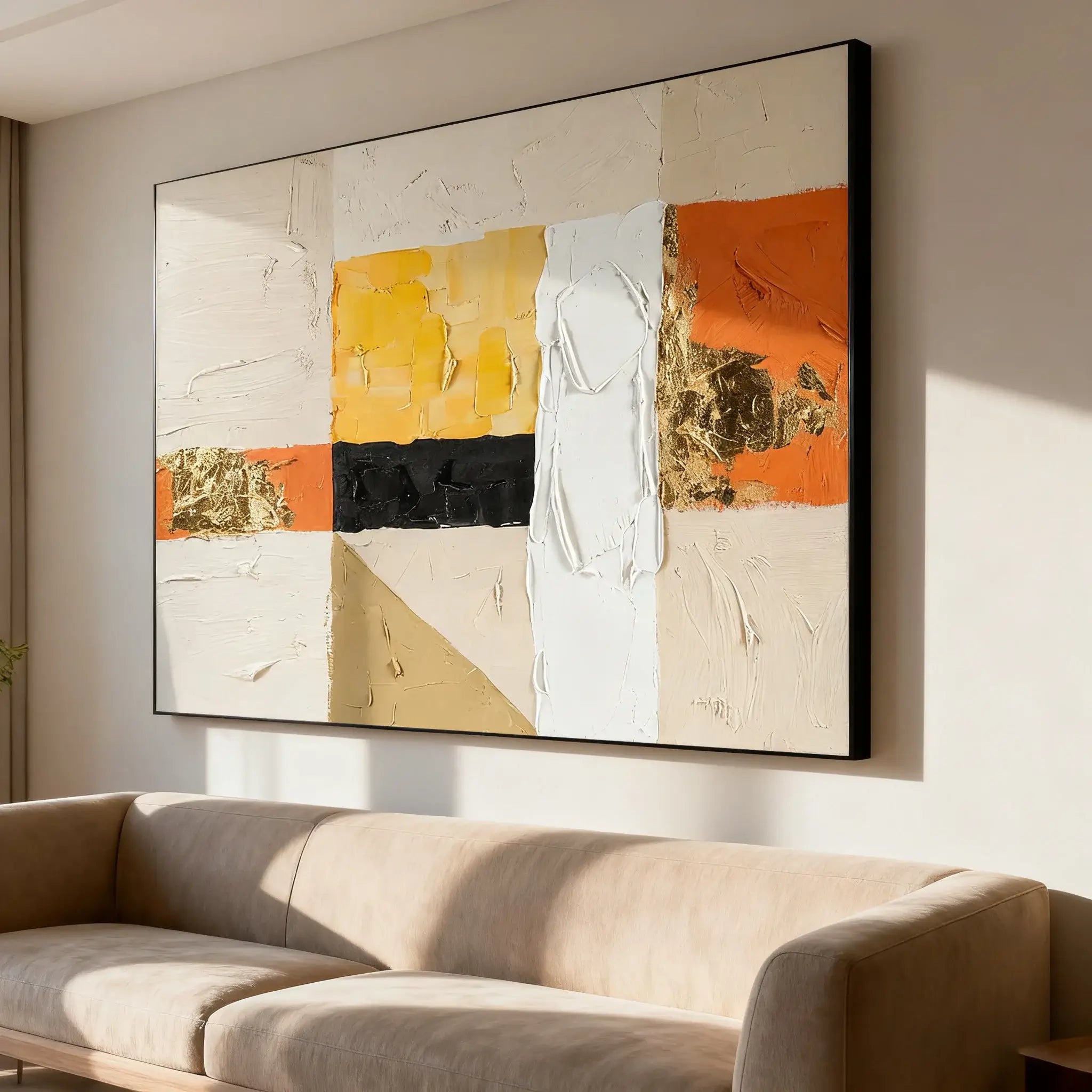 Abstract art painting on a wall above a beige sofa