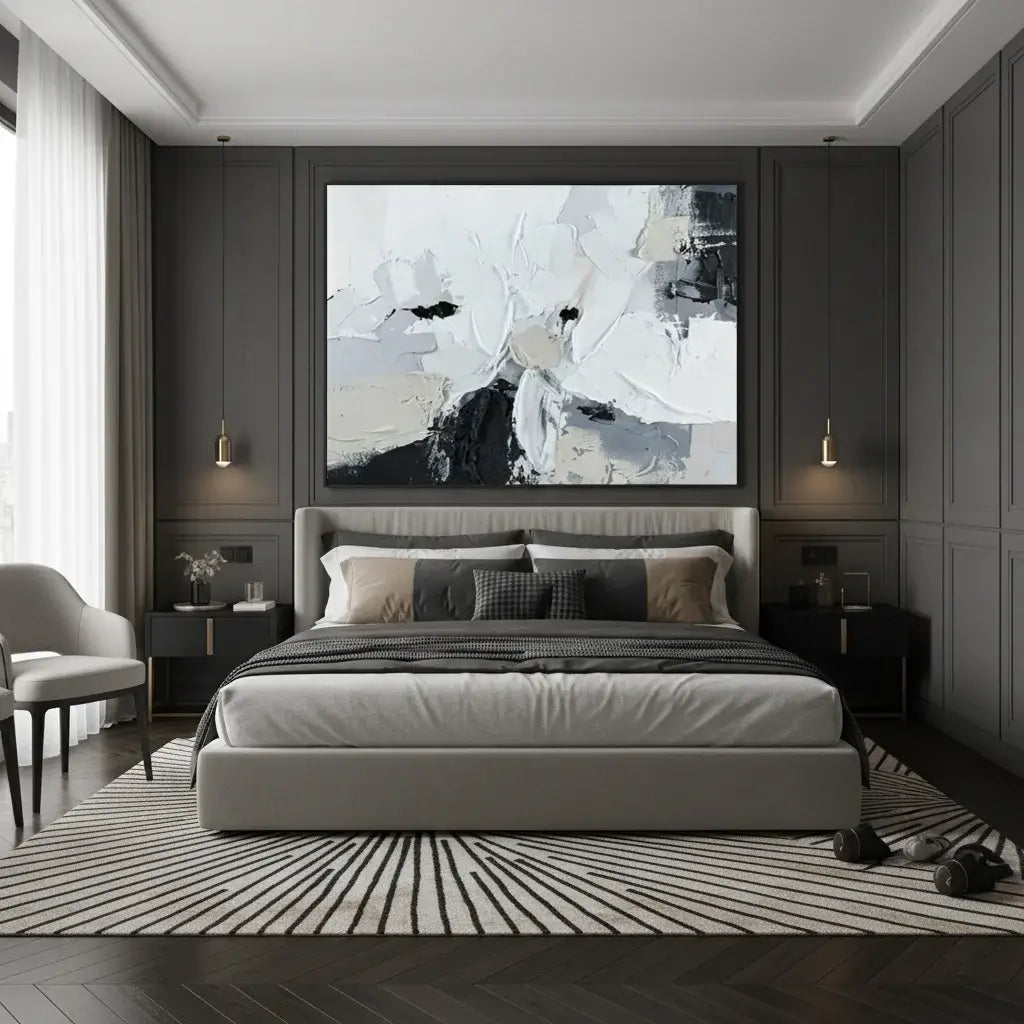 Modern bedroom with a bed, abstract painting, and side tables.