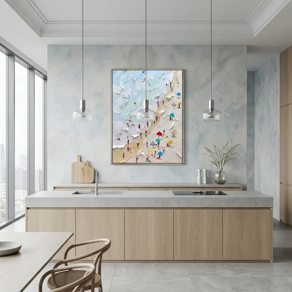 Modern kitchen with light wood cabinets, marble countertop, and abstract wall art.