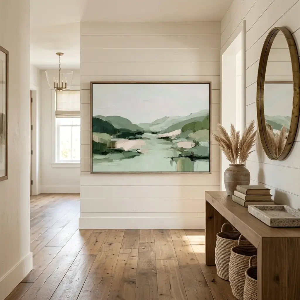 Modern interior with a large abstract landscape painting on a wall, wooden floor, and decorative items.