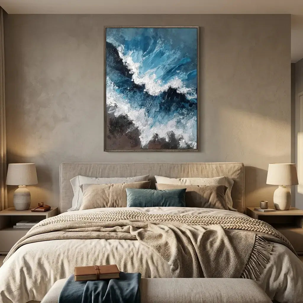 Modern bedroom with abstract art on the wall, bed with pillows, and lamps.