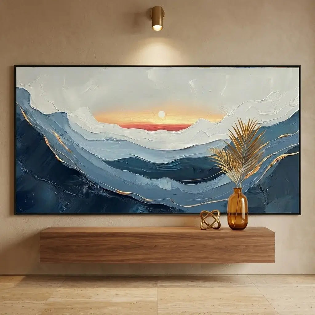 Living room with a large abstract painting, wooden console table, and wicker chair by a window with ocean view.