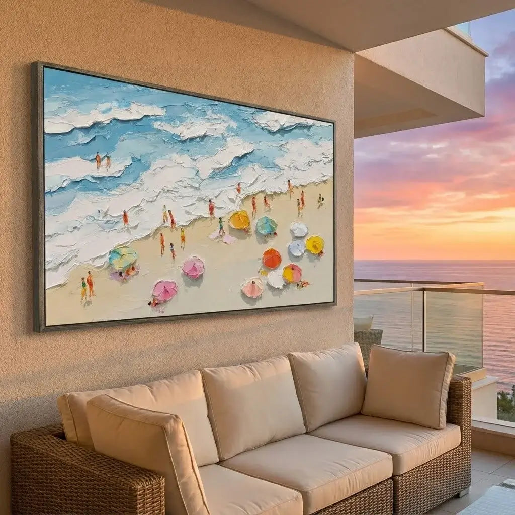 Beach scene painting on a wall above a beige sofa with a balcony view of a sunset.