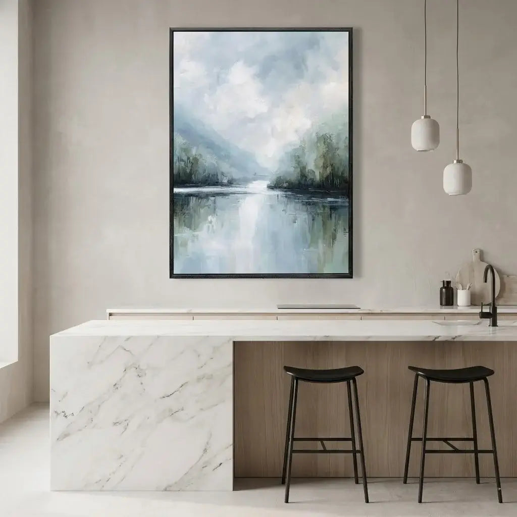 Modern kitchen with marble countertop, black stools, and a large landscape painting on the wall.