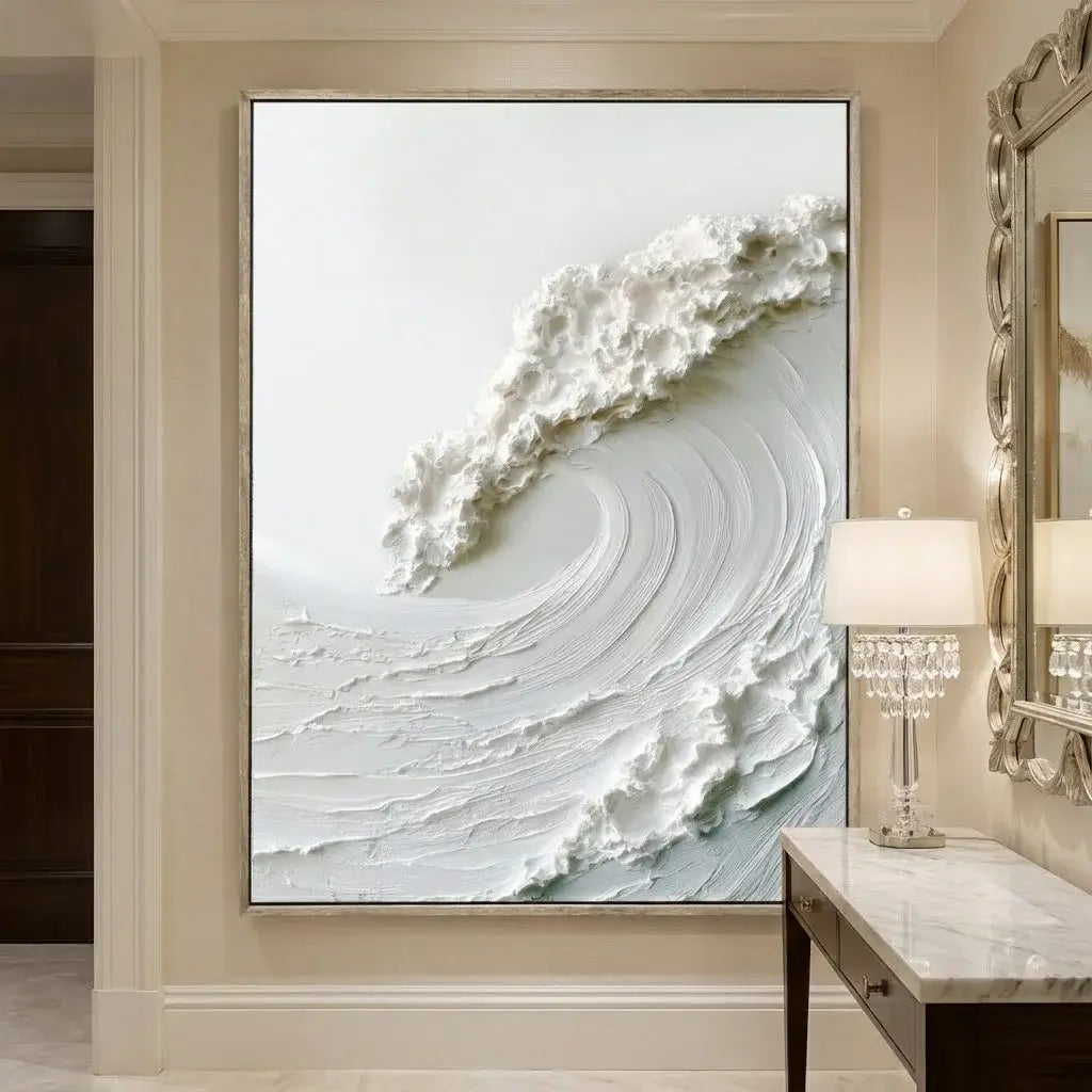 Framed abstract artwork of a wave on a wall in a room with a lamp and mirror.