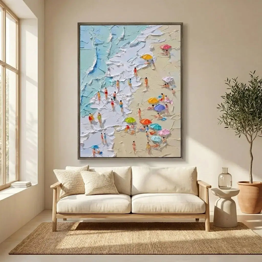 Living room with a beach scene painting on the wall, beige sofa, and plant.