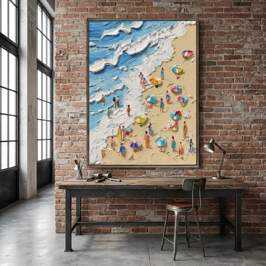 Beach scene artwork on a brick wall above a desk with a lamp.