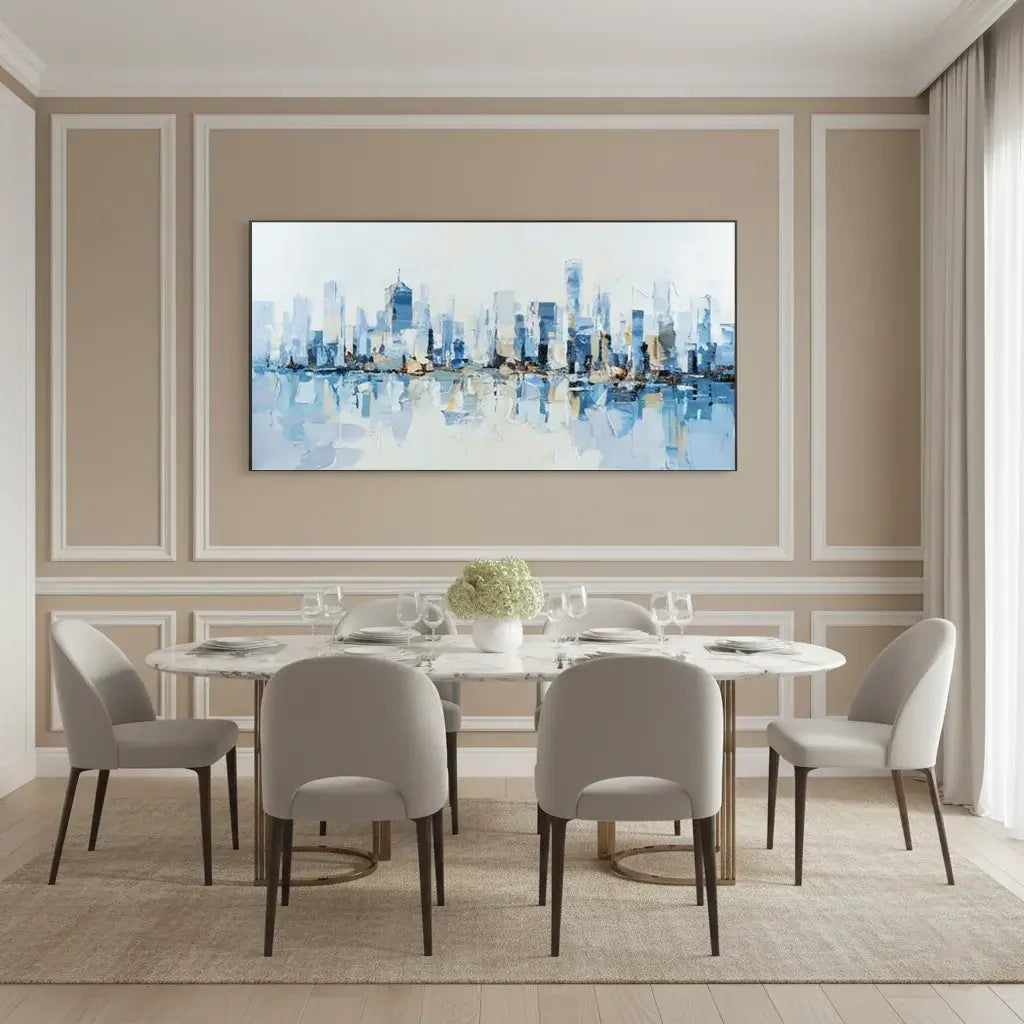 Dining room with a cityscape painting on the wall above a round table with chairs.