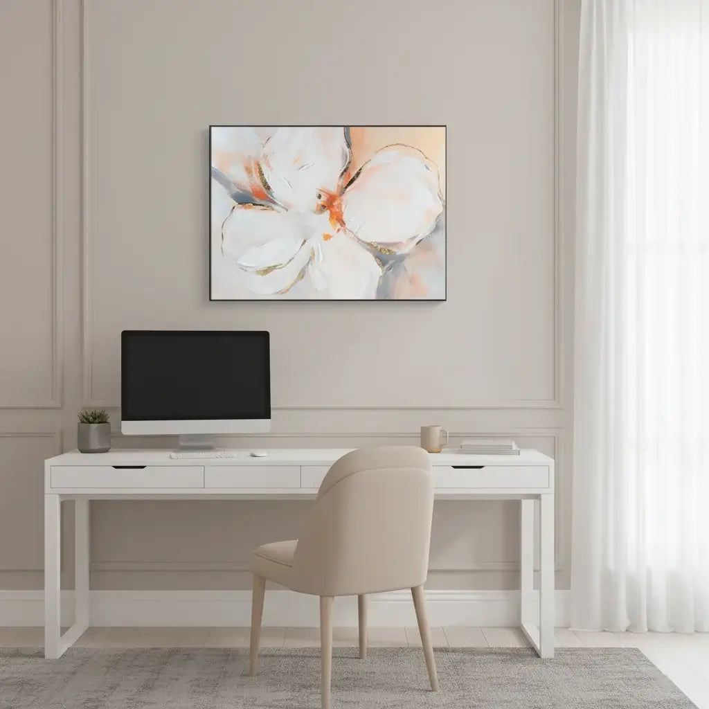 Modern home office with a white desk, beige chair, and floral artwork on the wall.