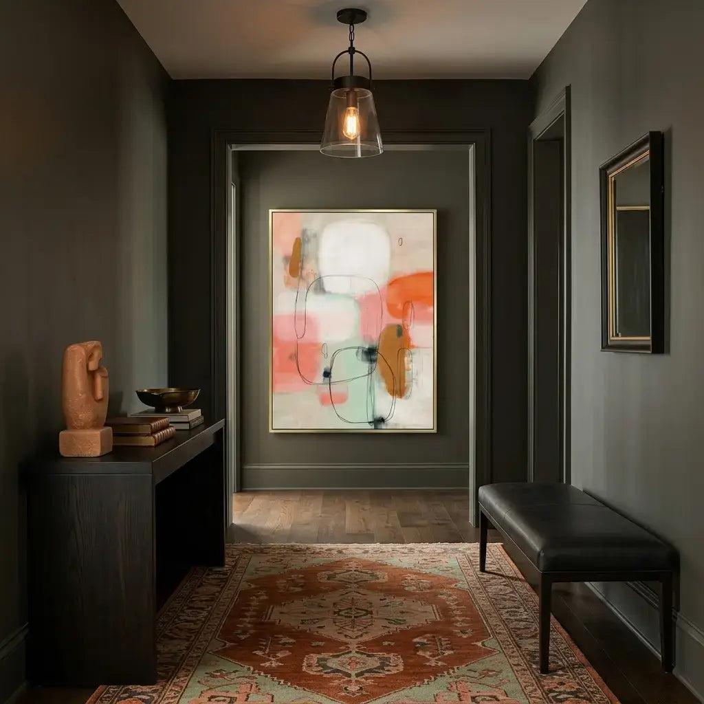 Modern interior hallway with abstract art, bench, and decor items.