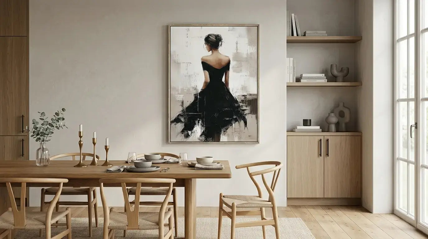 Dining room with wooden table and chairs, framed artwork on the wall, and a window.