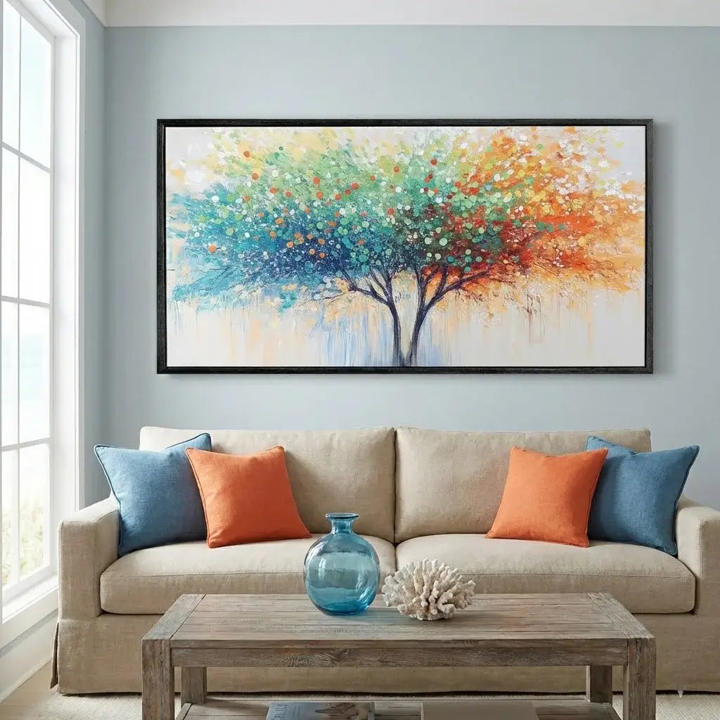 Living room with a beige sofa, colorful pillows, a wooden coffee table, and a large abstract tree painting on the wall.