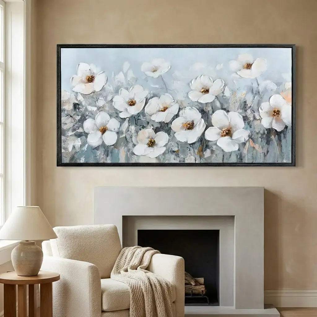 Framed floral painting above a fireplace in a living room.