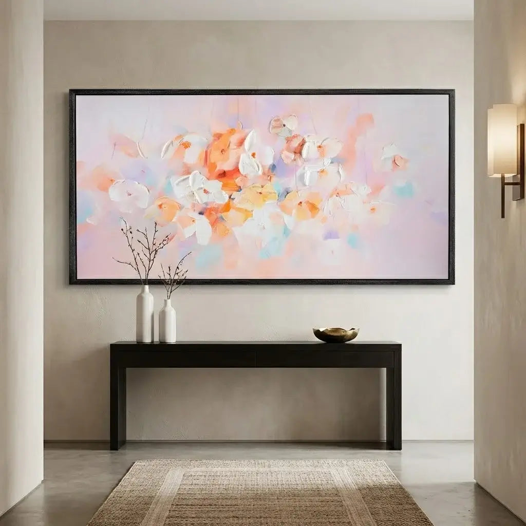 Modern interior with a colorful abstract painting on the wall above a black console table.