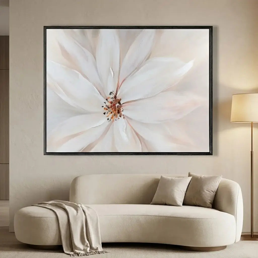 Framed abstract art above a beige sofa in a living room setting