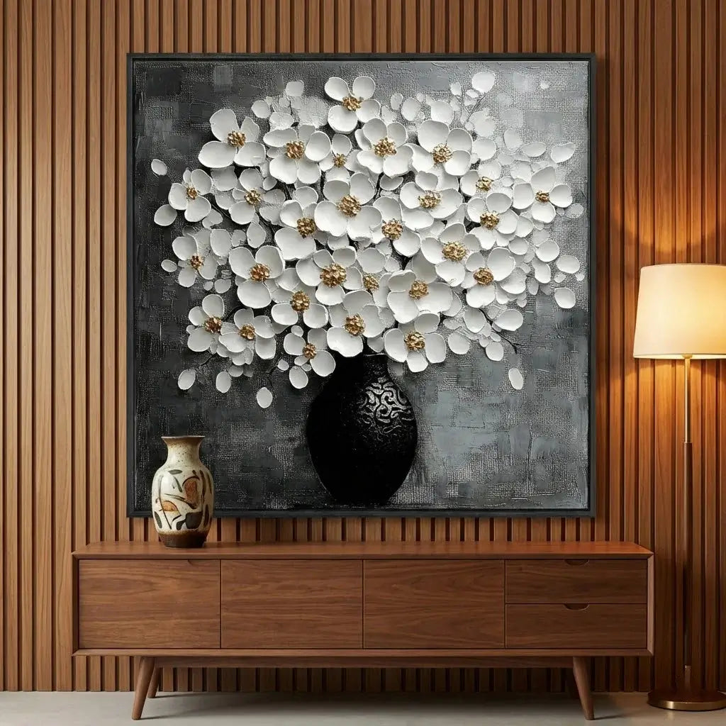 Framed floral artwork on a wall above a wooden cabinet with decorative vases.