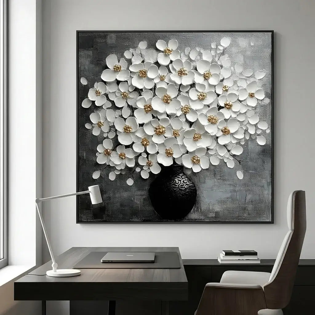 Decorative floral painting on a wall above a desk with a lamp and chair.