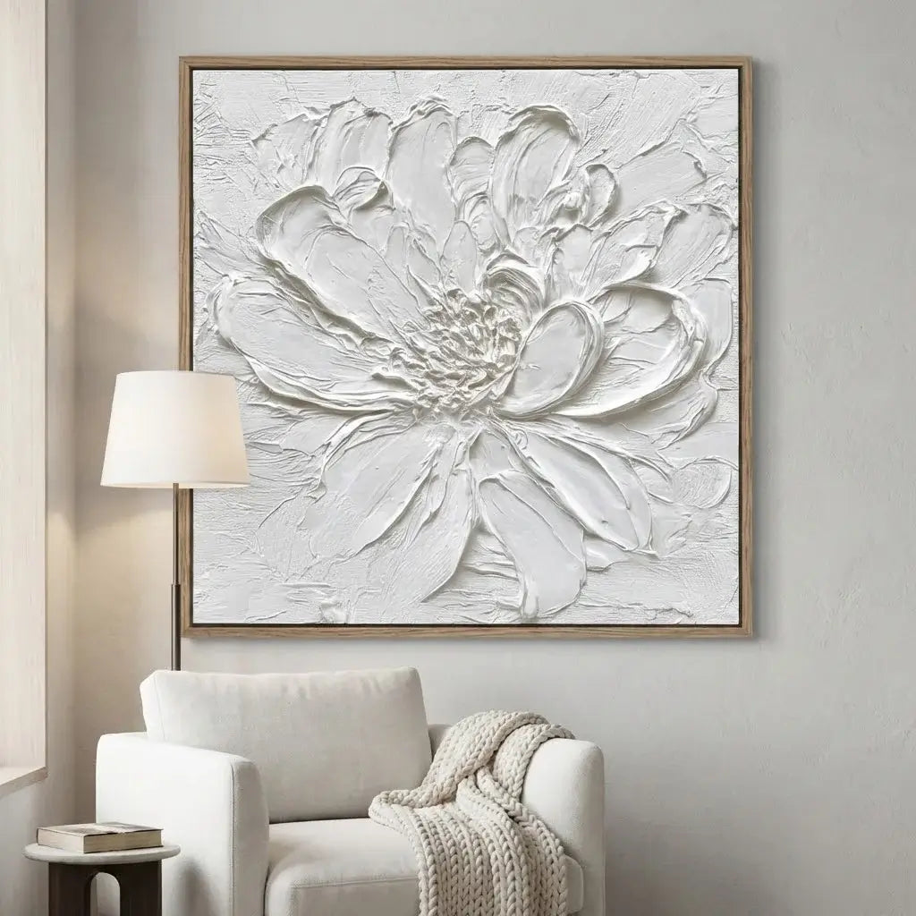 Abstract floral artwork in a living room setting with a chair and lamp.