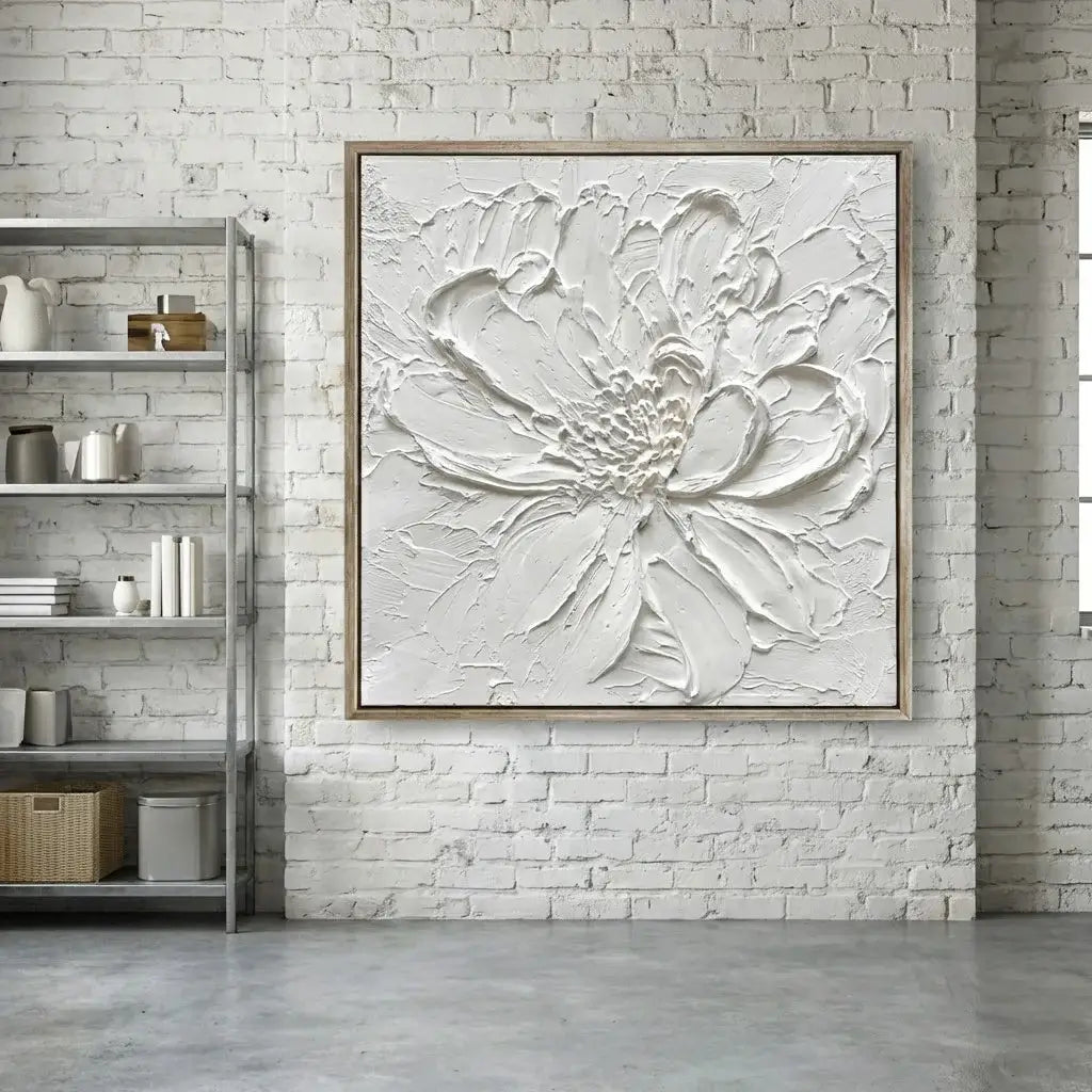 White floral artwork on a brick wall with a shelf in the background