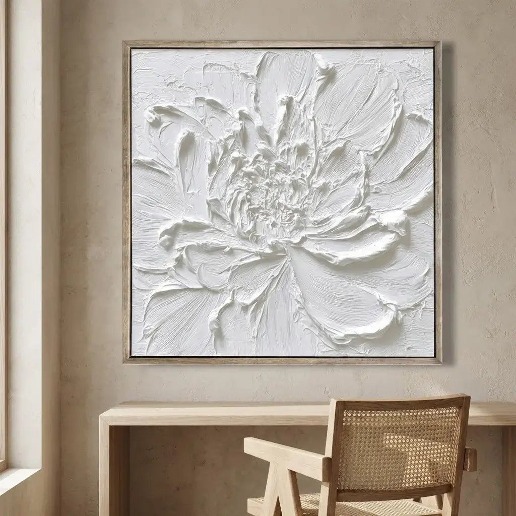 Abstract floral painting in a neutral setting with a desk and chair.