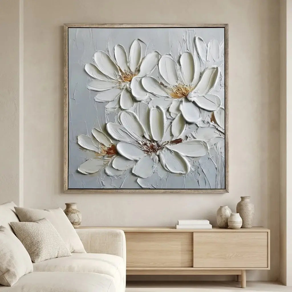 Floral painting on a wall above a wooden console table in a living room.
