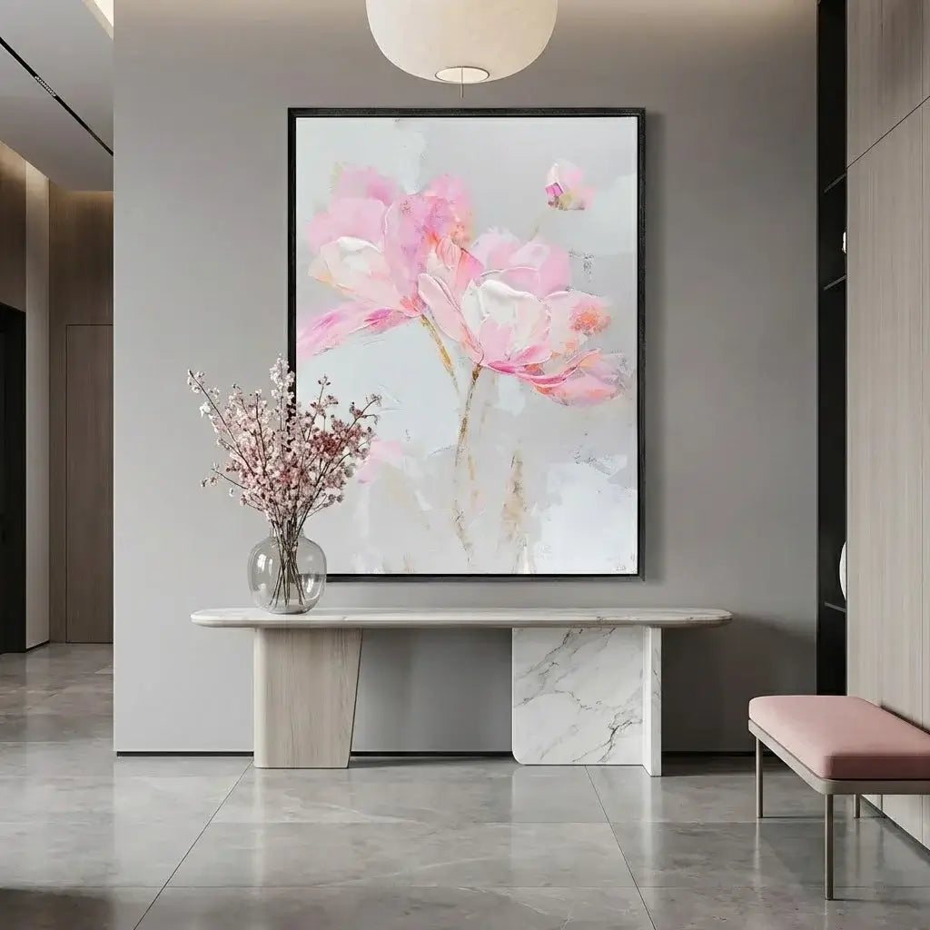 Modern interior with a floral painting on the wall, marble table, and vase with flowers.