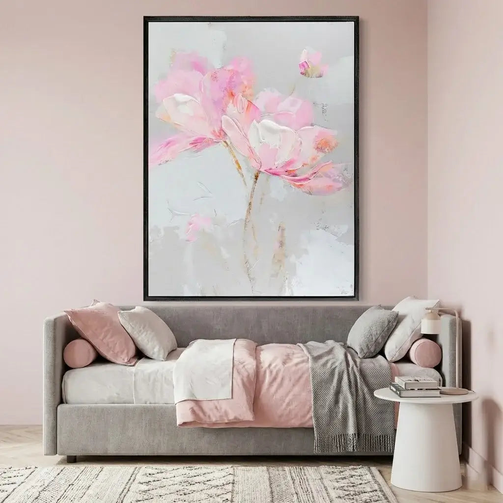 Floral artwork above a sofa in a living room setting