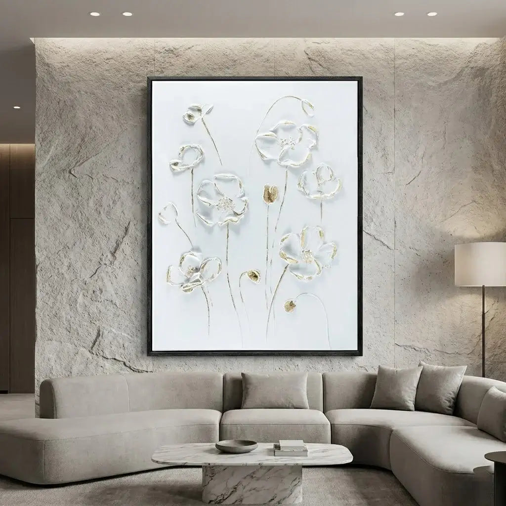 Modern living room with a large floral artwork on a textured wall above a gray sectional sofa.