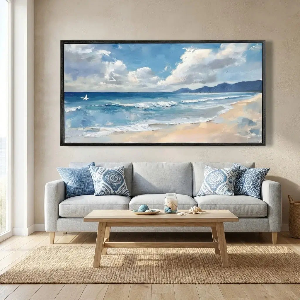 Living room with a large framed beach painting above a gray sofa.
