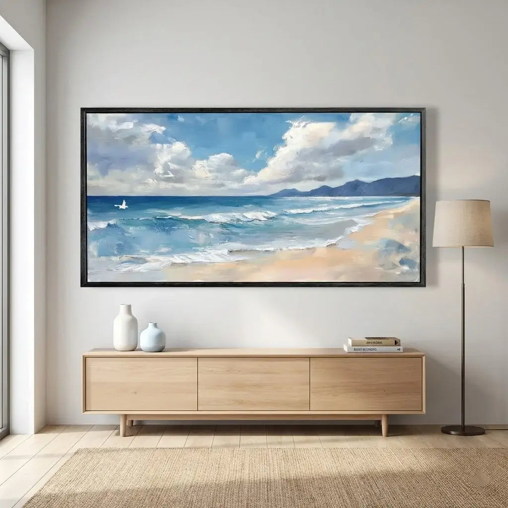 Panoramic ocean view painting on a wall above a wooden console table.