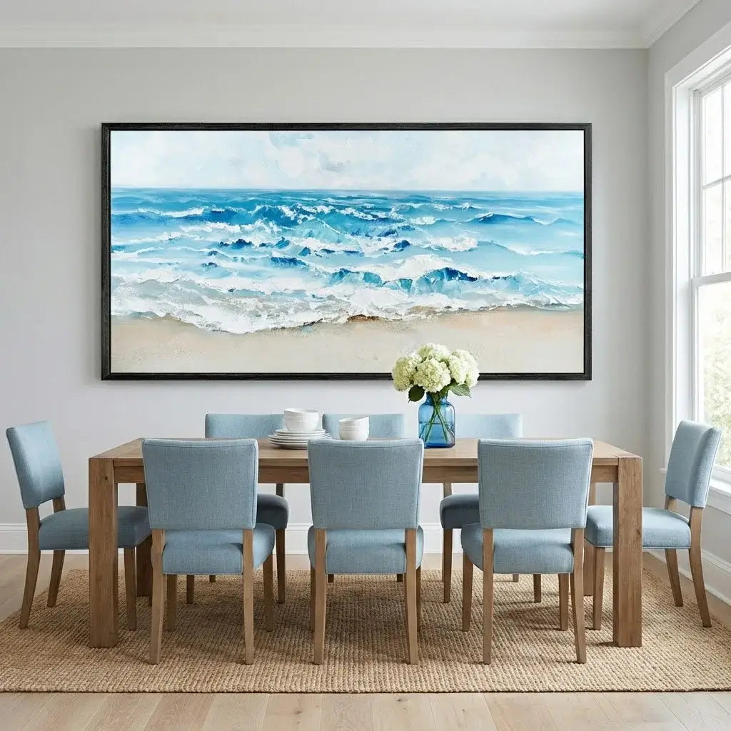 Dining room with a large framed beach scene painting on the wall.