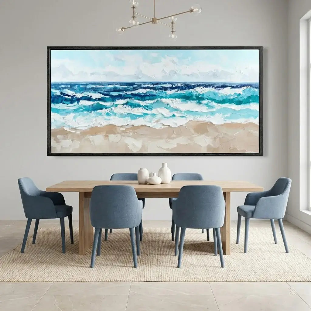 Dining room with a large framed beach scene painting above a wooden table and chairs.