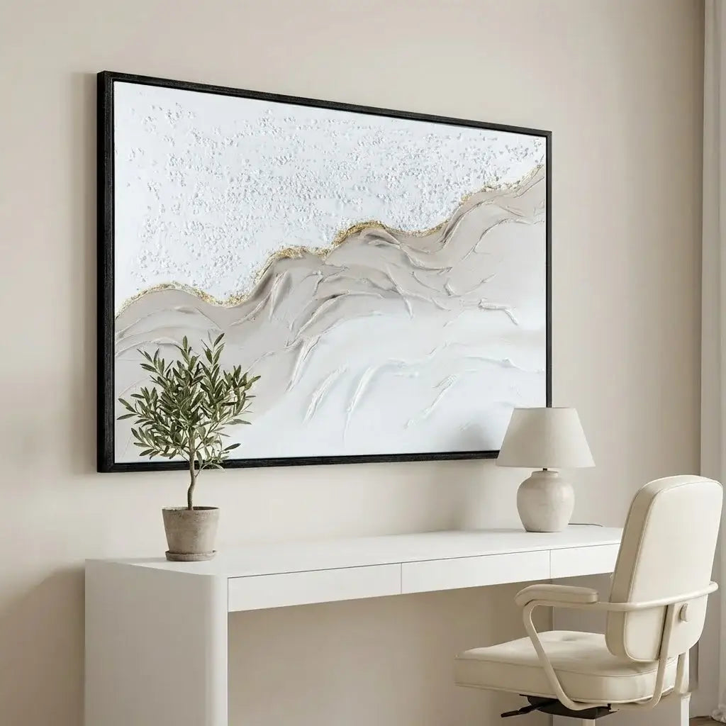 Modern office setup with a white desk, chair, and abstract painting on a beige wall.