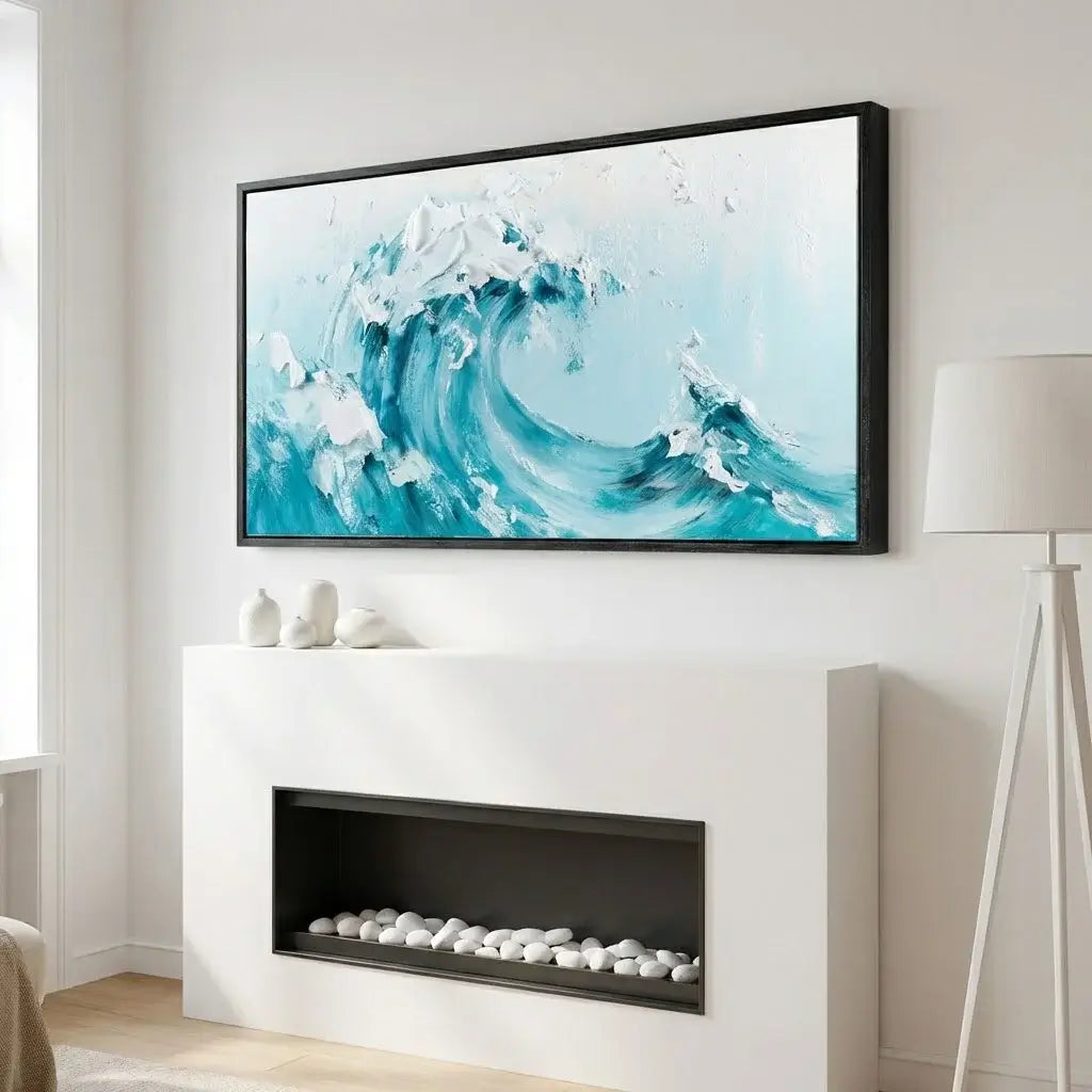 Framed abstract artwork of a wave on a wall above a fireplace.