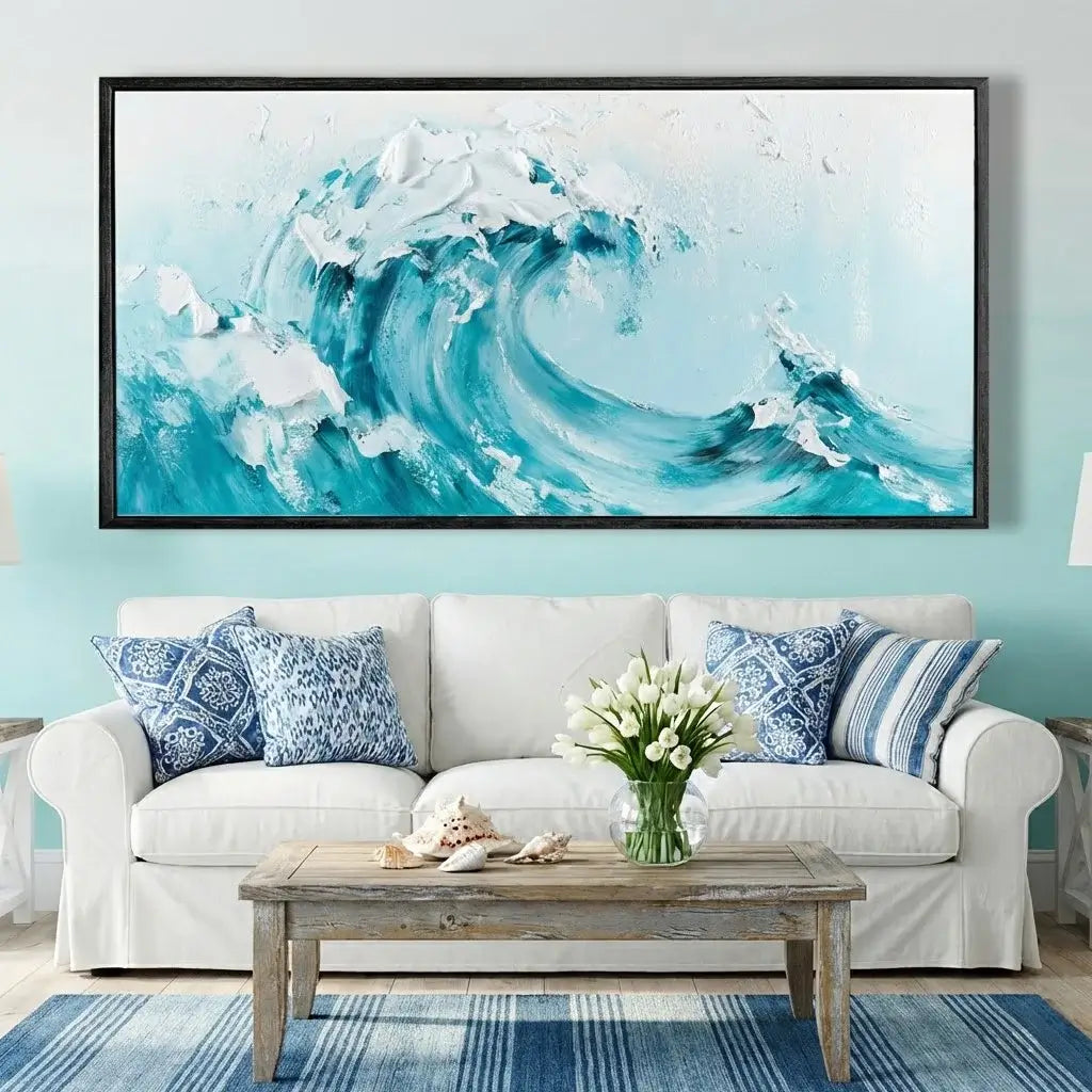 Living room with a large abstract wave painting on the wall, white sofa with blue patterned pillows, wooden coffee table, and floral arrangement.