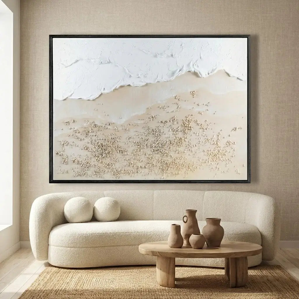 Beige sofa with a wooden coffee table and vases in a room with a large abstract painting on the wall.