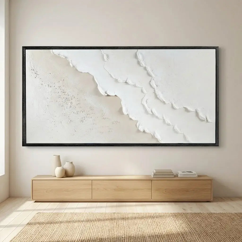 Framed abstract artwork on a wall above a wooden console table.
