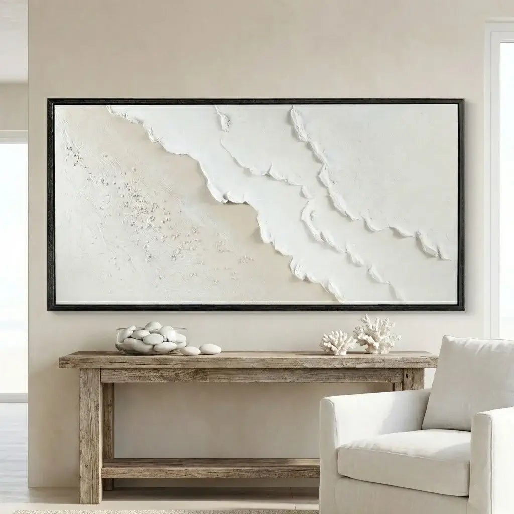 Living room with a large abstract painting on the wall, wooden console table, and white armchair.