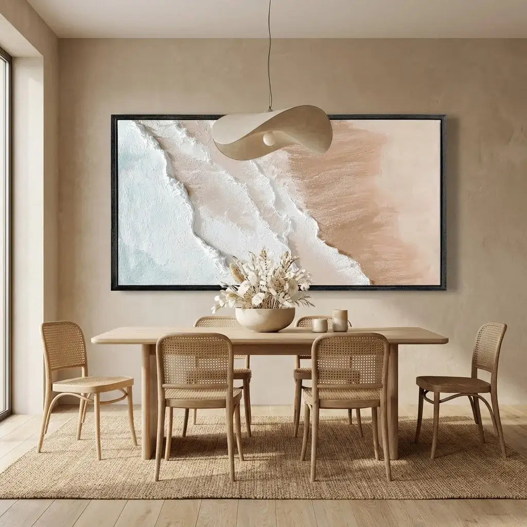 Dining room with wooden table and chairs, abstract painting on the wall, and pendant light.