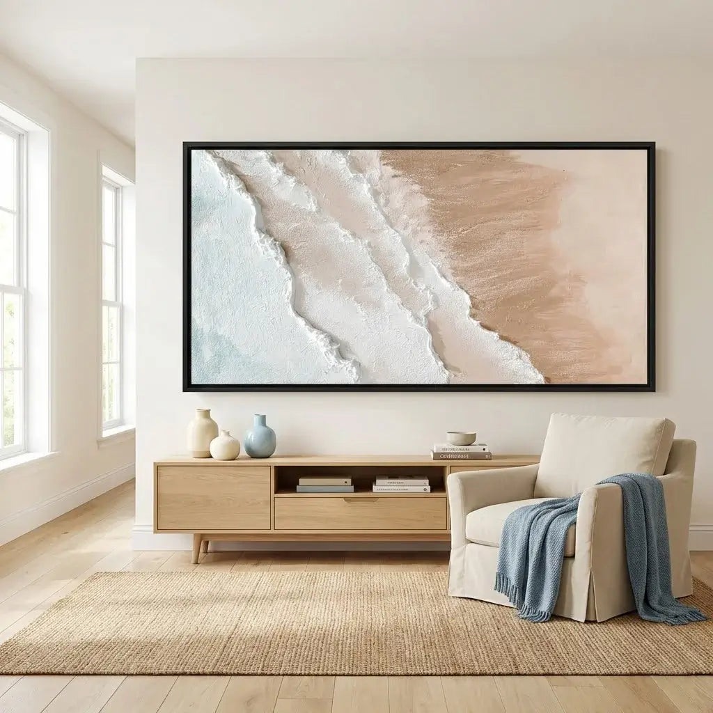 Living room with a large abstract painting on the wall, a beige armchair, and a wooden side table.