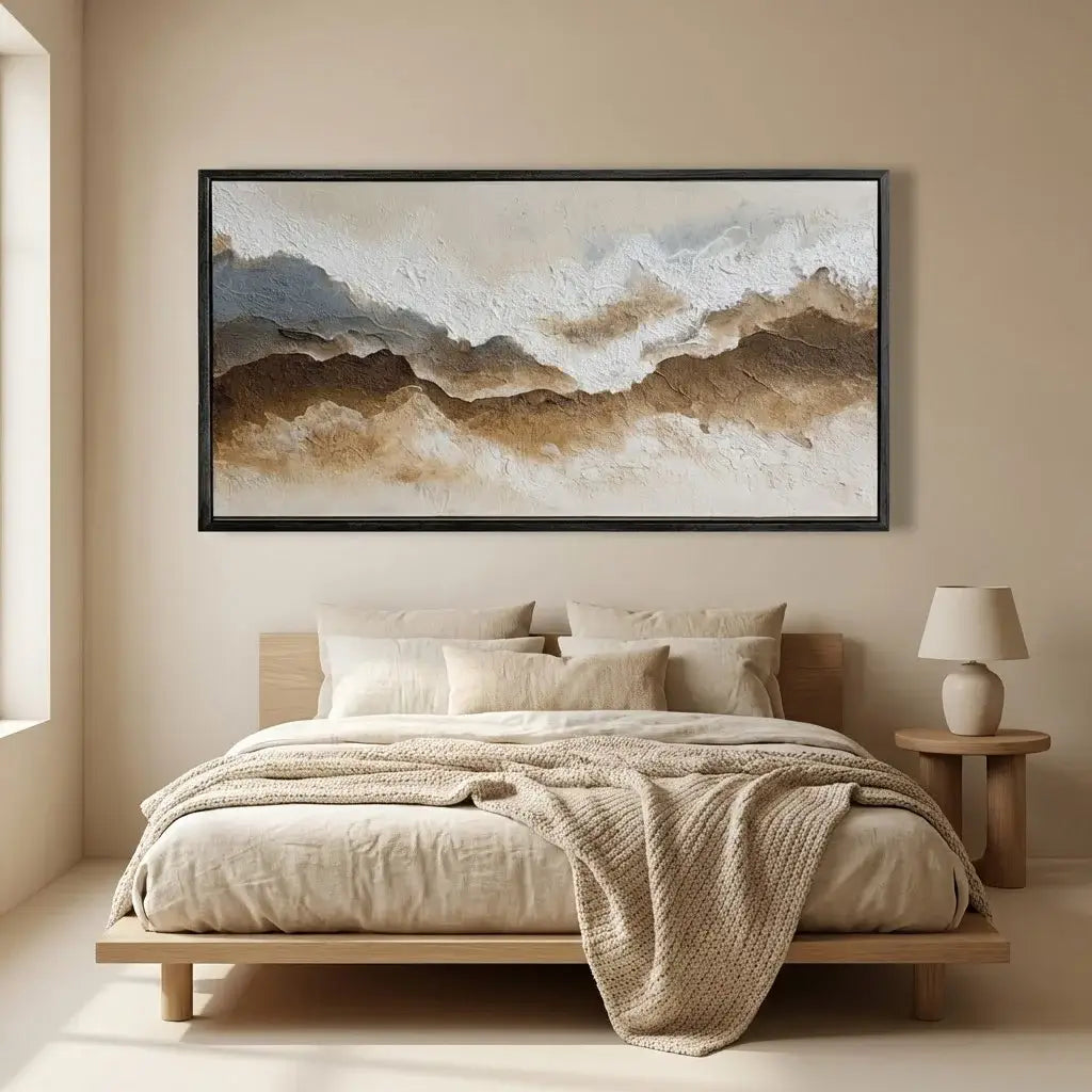 Beige bedroom with a bed, lamp, and abstract wall art