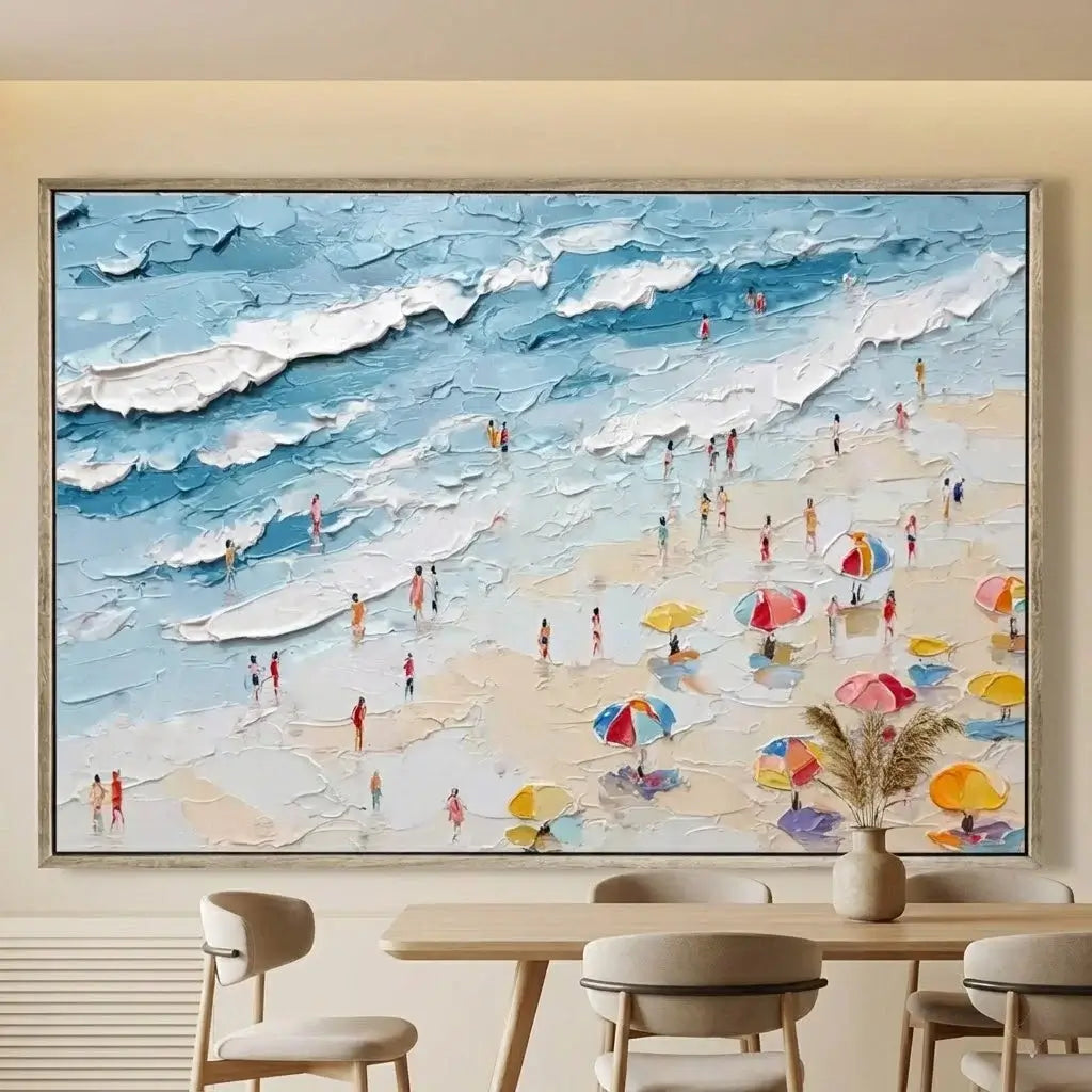 Framed painting of a beach scene with people and umbrellas in a dining room.
